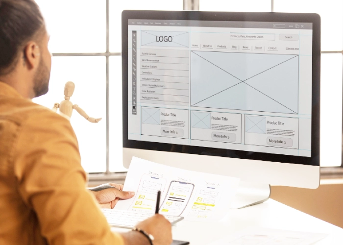 Designer reviewing a Website Mockup to identify website design mistakes before development